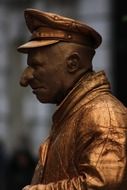 side view of a bronze figure