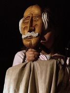 puppeteer with wooden figure