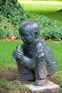 child sitting statue