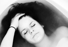 black and white portrait of girl in a bath