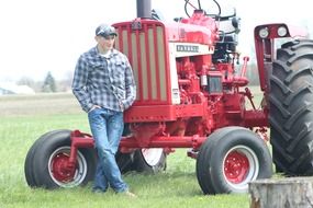 Farmer near the tractor