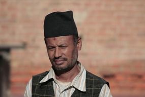 Portrait of nepalese man with hat on his head