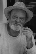 black and white photo of an elderly man in a hat