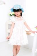 little cute girl in a white dress
