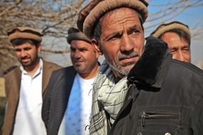 men in a village in Afghanistan