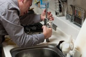 Installation faucet in the kitchen