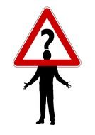 A triangular road sign with question mark on a background of the person silhouette