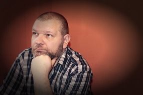 thoughtful man looks into the distance