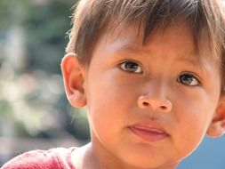 portrait of cute asian child on blurred background