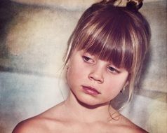 pensive girl's face with blond hair