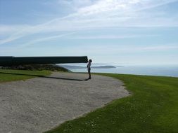 photo of a woman at the muzzle of the gun in the park