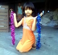 Child in orange dress