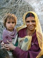 mother is holding a baby in India
