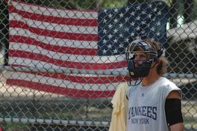 baseball player girl on the background of the american flag