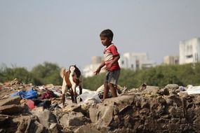Child with the goat in India