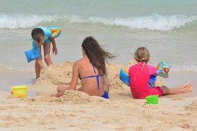 people play on the beach