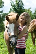 girl with colorful and cute little horse