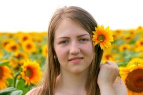 portrait of a girl with a sunflower in her hair