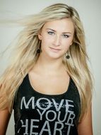 photo of a beautiful blonde in a black tank top