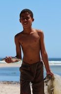 boy with fish in south africa