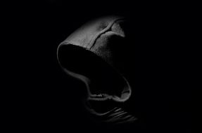 hooded death in the darkness