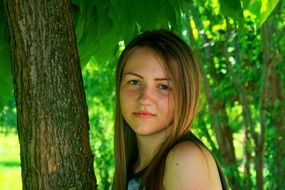 portrait of a girl on the background of tree
