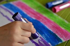 painting, child hand with paint stick