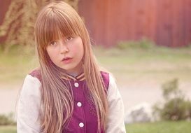 blond girl with long hair face portrait