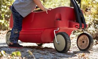 red children's car and baby