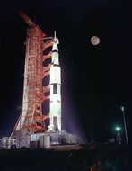 Apollo 17 at the start against the backdrop of the night moon