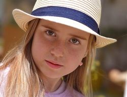 young girl in the hat view
