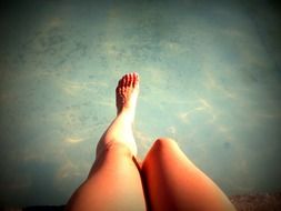 feet legs above the water