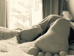 feet of a sleeping baby close up