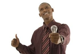 African with a light bulb in his hand