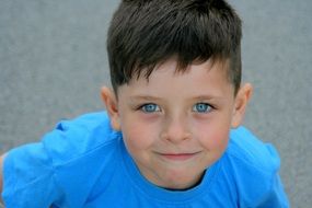 portrait of the blue-eyed boy in a blue T-shirt