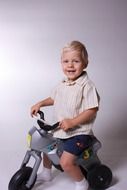 photo session of a happy child on a bicycle