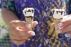 ice cream cones in hands