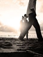 people walking at sunset