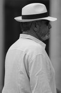 man in a hat black white photo