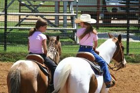 girls riding on a horses