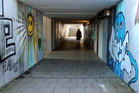 dark underpass tunnel with human person
