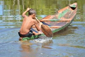 rio boy in damaged canoe