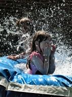 splashing water while swimming in the pool