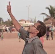 man on street pointing upwards, Sri Lanka, colombo