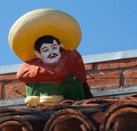 figurine of a mexican man in sombrero