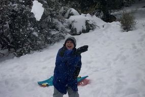 Playful boy on the snow