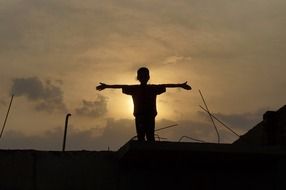 boy silhouette at sunset drawing