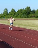 an athlete running 100 meters