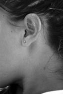 earring in the girl's ear