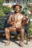 bollywood actor kapoor raj sits on bench, bronze sculpture, india, mumbai